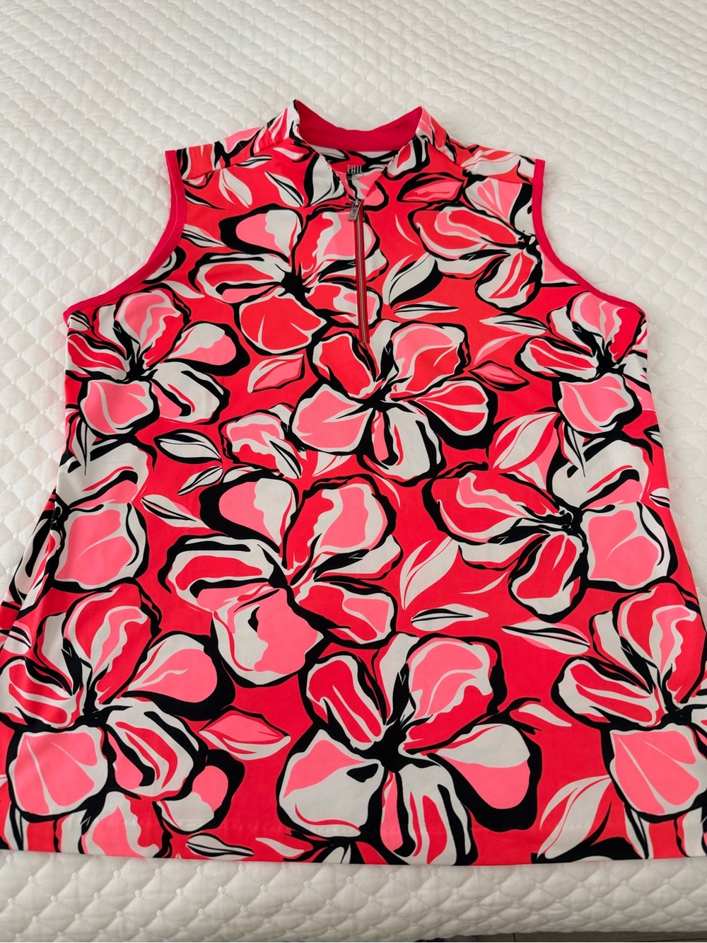 Ladies sleeveless top with 1/4 zip.